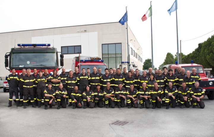 Emergency response vehicles and firefighters handling road incident on A4 near Lake Garda