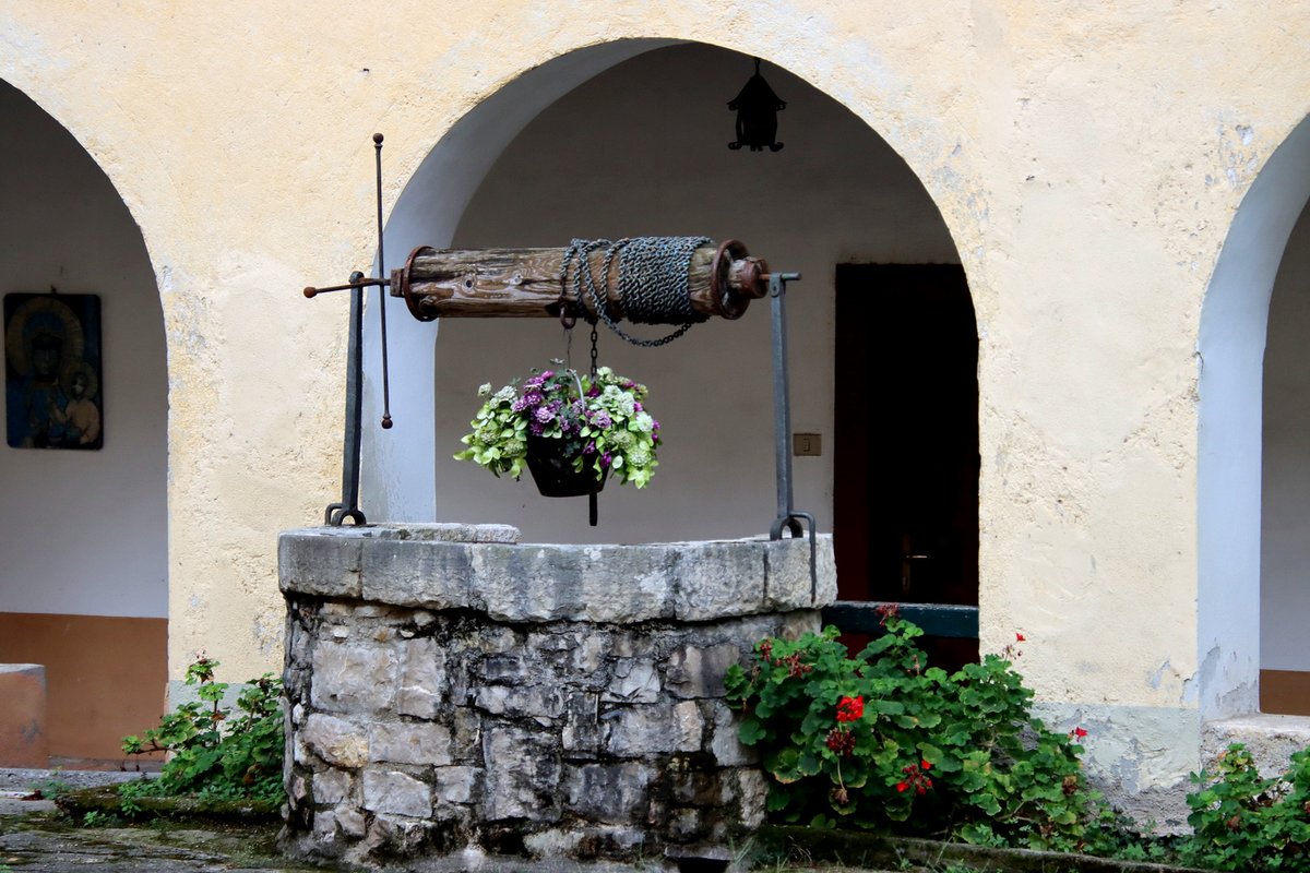 Ancient stone well in the cloister of the Capuchin Convent of Barbarano