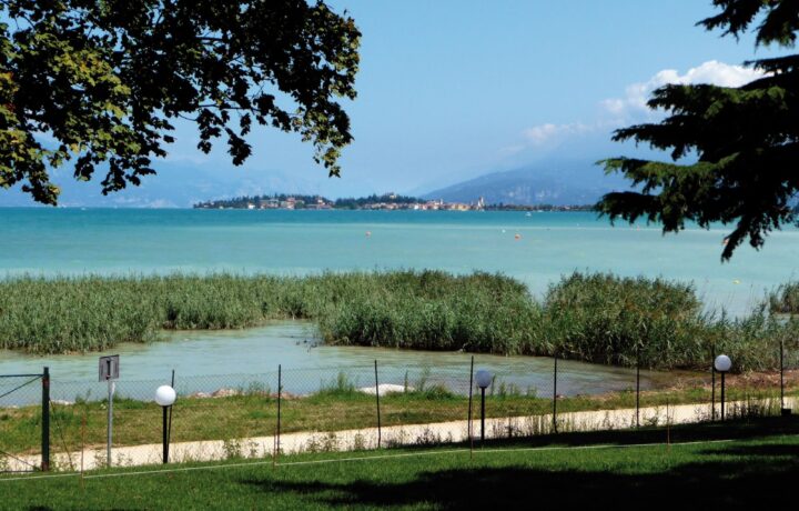 Panoramic expanse of Lake Garda basin framed by the surrounding morainic hills and mountain ridges