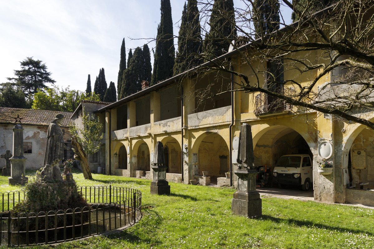 The historic portico and courtyard of the ancient Lazzaretto facing Lake Garda in Salò