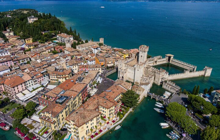 Scenic panorama of the Scaliger Castle in Sirmione surrounded by Lake Garda waters