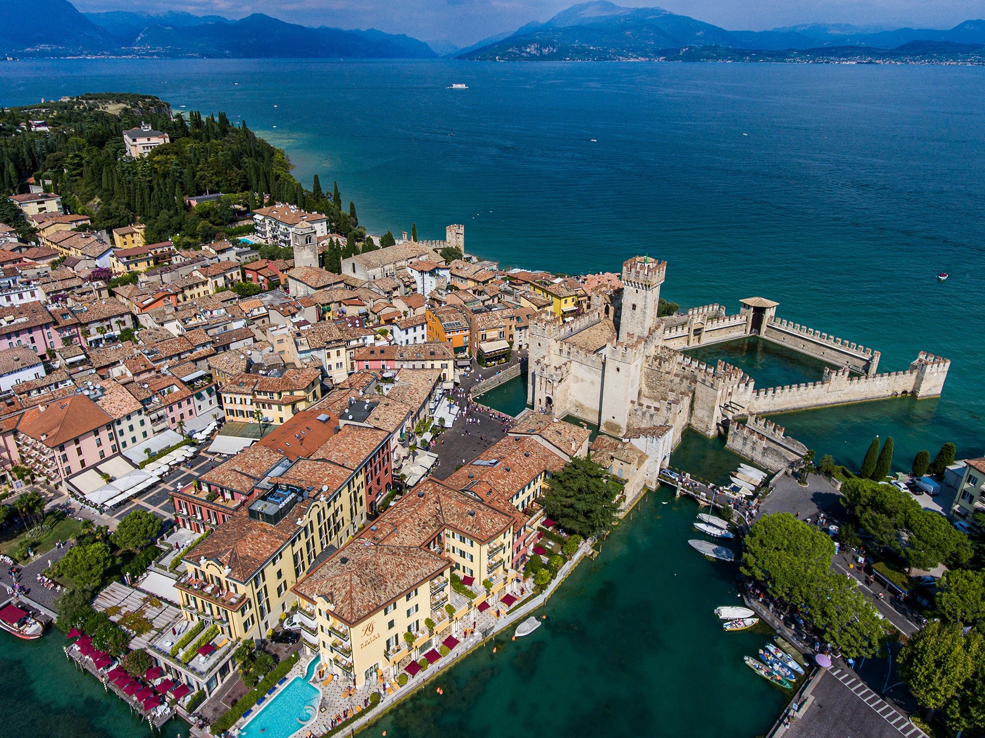 Scenic panorama of the Scaliger Castle in Sirmione surrounded by Lake Garda waters
