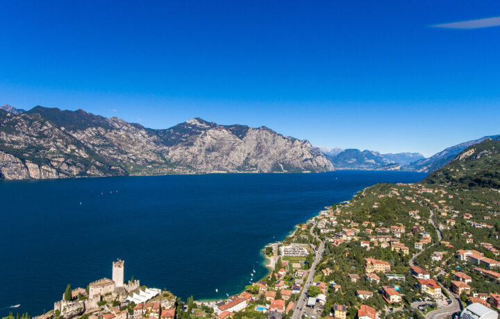 Aerial view of Tignale plateau and sheer dolomite cliffs above Lake Garda